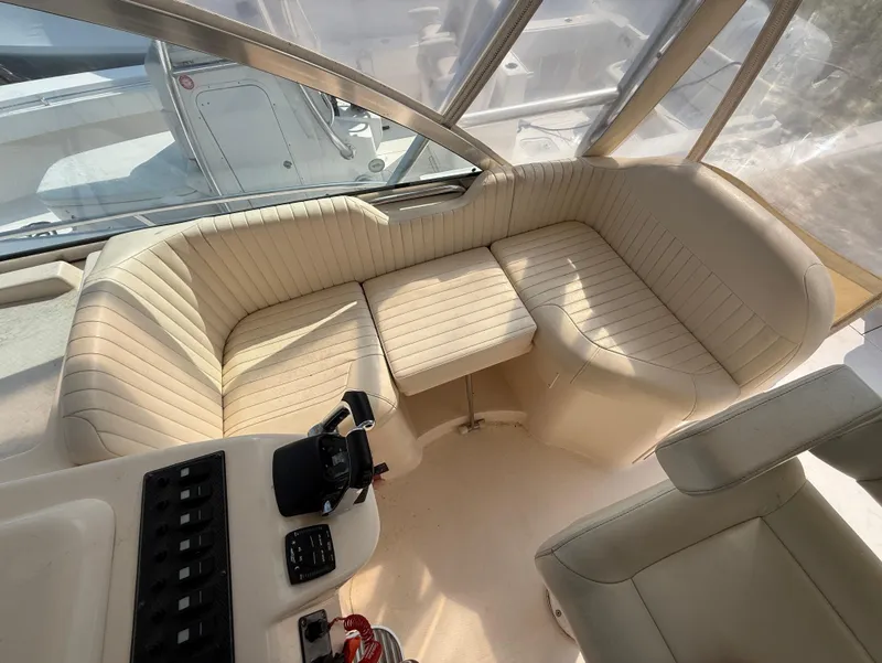 Slide: The Image of 2008 Grady-White 330 Express boat interior with beige seating and control panel. - 35