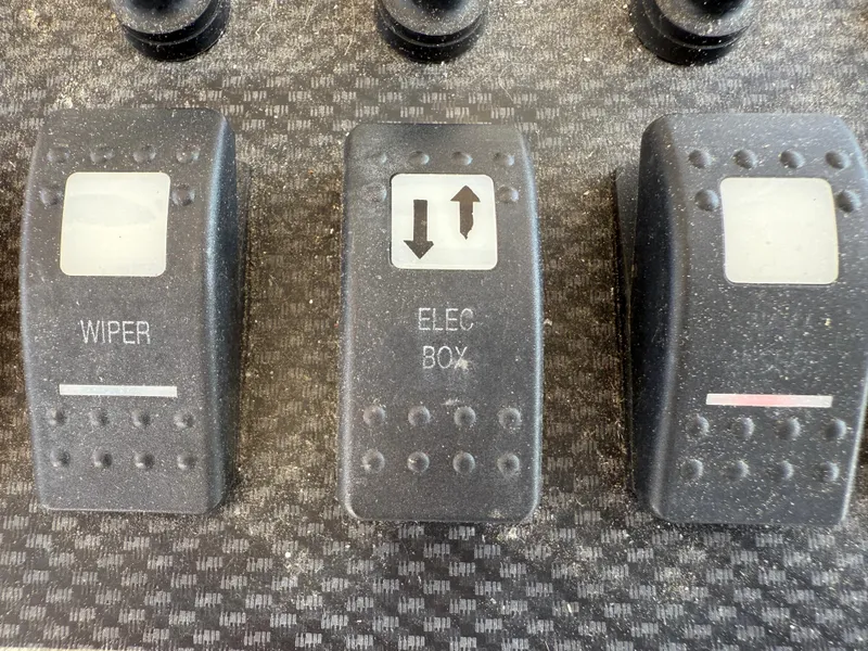 Slide: The Image of Control panel switches on a 2008 Grady-White 330 Express boat. - 38