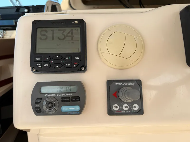 Slide: The Image of Control panel of a 2008 Grady-White 330 Express boat with navigation and audio systems. - 43