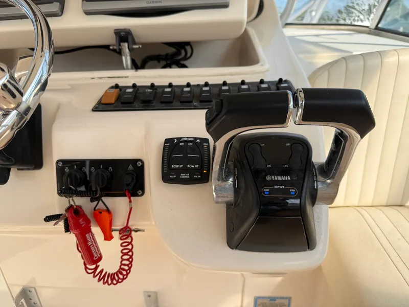 Slide: The Image of Control panel of 2008 Grady-White 330 Express boat with Yamaha throttle. - 44
