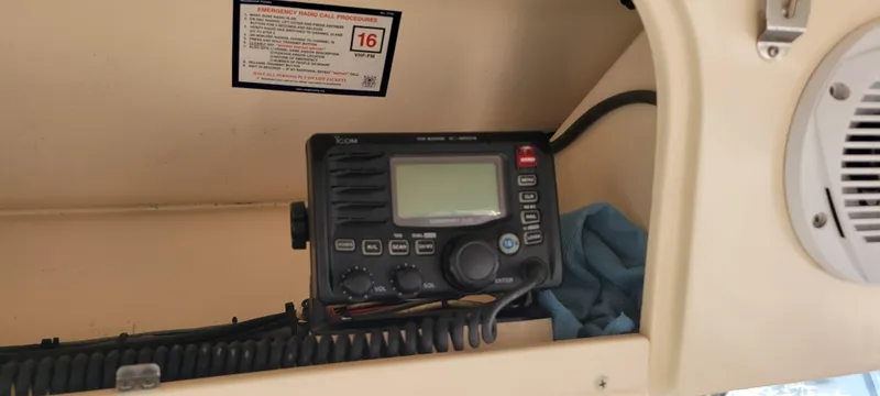 Slide: The Image of VHF radio on 2008 Grady-White 330 Express boat dashboard. - 5