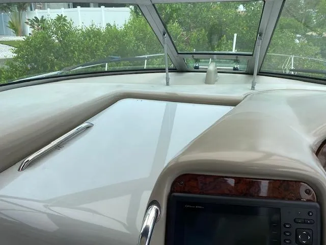 Slide: The Image of 2006 Sea Ray Sundancer helm with navigation equipment and windshield view. - 10