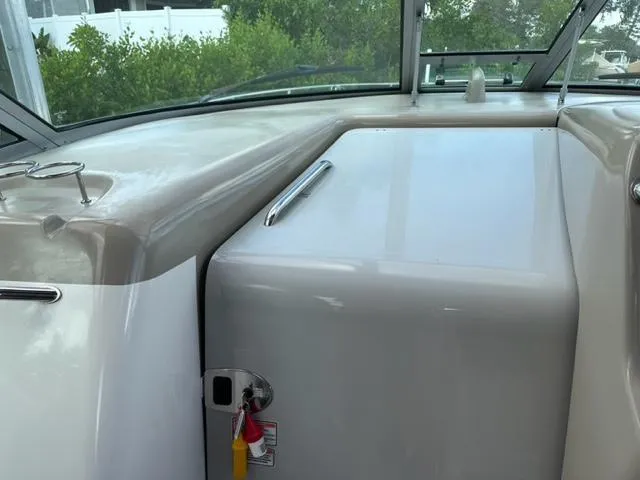 Slide: The Image of 2006 Sea Ray Sundancer boat interior with sleek dashboard and window view. - 12