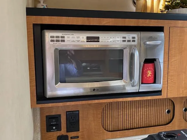 Slide: The Image of Built-in LG microwave in 2006 Sea Ray Sundancer yacht kitchen. - 19