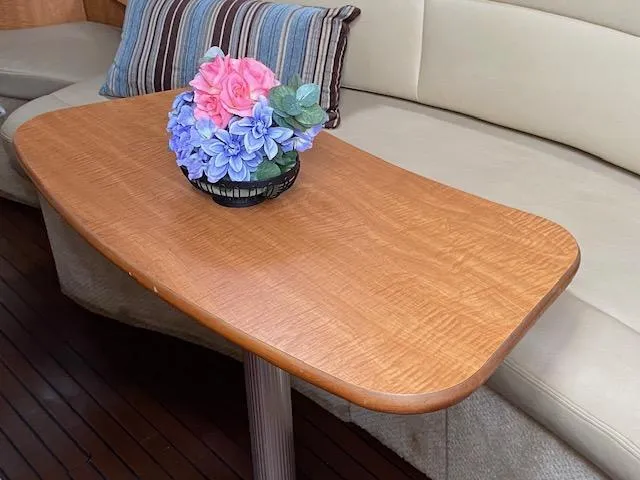 Slide: The Image of Wooden table with floral centerpiece in 2006 Sea Ray Sundancer yacht interior. - 20
