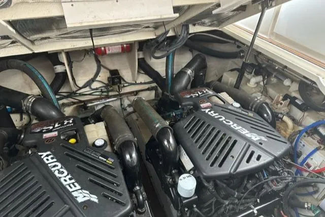 Slide: The Image of Engine room of a 2006 Sea Ray Sundancer with dual Mercury engines. - 26