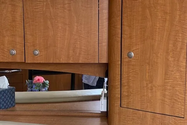 Slide: The Image of Wooden cabinets and mirror inside a 2006 Sea Ray Sundancer yacht. - 35