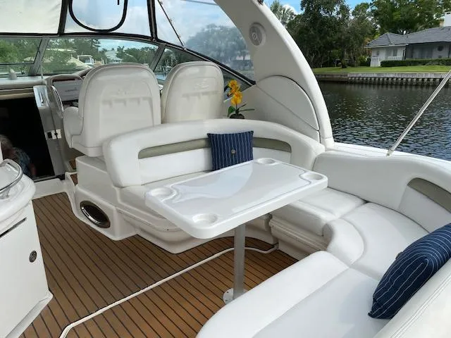 Slide: The Image of Luxurious 2006 Sea Ray Sundancer interior with white seating and wooden flooring. - 5