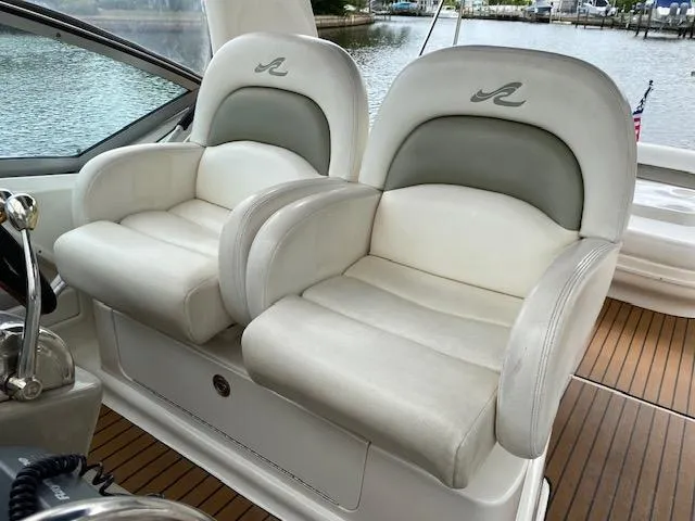 Slide: The Image of 2006 Sea Ray Sundancer boat seats with logo, overlooking water. - 9