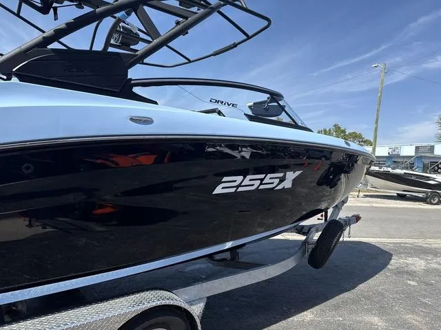 Slide: The Image of Close-up of 2025 Yamaha Boats 255XD in powder blue, showcasing sleek hull design. - 11