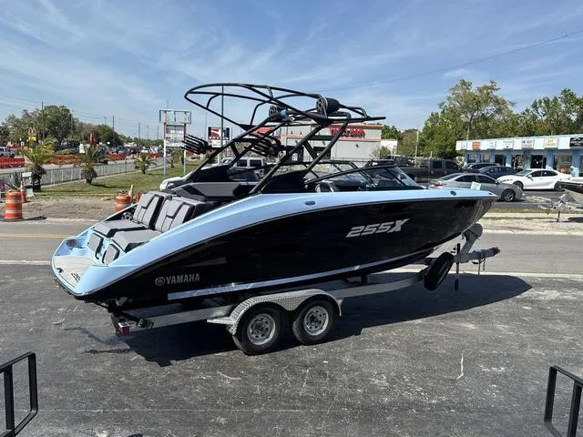 Slide: The Image of 2025 Yamaha Boats 255XD, powder blue, stern view with sleek design and modern features. - 12