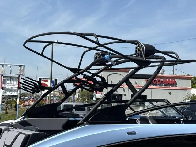 Slide: The Image of 2025 Yamaha Boats 255XD in powder blue, featuring sleek design and advanced wakeboard tower. - 13