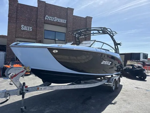 Slide: The Image of 2025 Yamaha Boats 255XD dashboard with touchscreen and steering wheel, featuring modern design. - 4