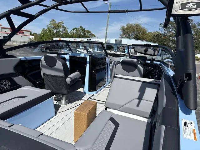 Slide: The Image of 2025 Yamaha Boats 255XD interior with speaker detail, featuring sleek black framework. - 9