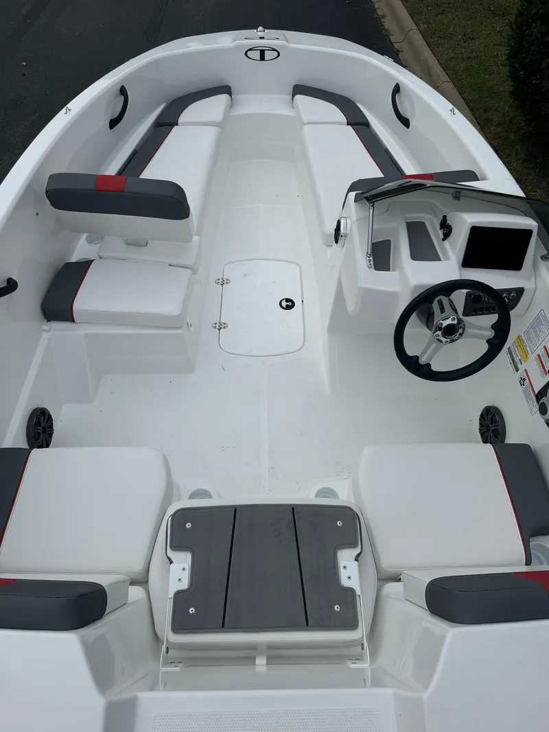 Slide: The Image of 2025 Tahoe T16 boat interior with seating and steering console. - 3