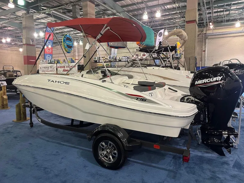 The Image of 2025 Tahoe T16 boat with Mercury engine on display indoors. - 1