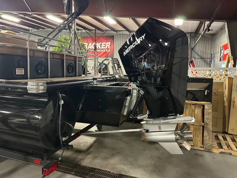 Slide: The Image of 2025 Regency 250 LE3 Sport boat with Mercury outboard motor in showroom. - 5