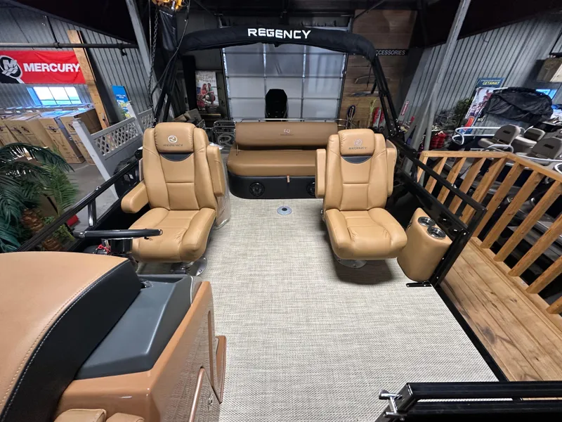 Slide: The Image of 2025 Regency 250 LE3 Sport boat interior with tan leather seats and modern design. - 9