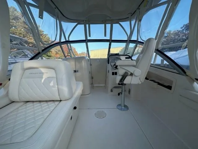 Slide: The Image of 2024 Grady-White 255 FREEDOM boat interior with white seating and helm. - 12