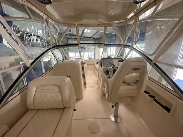 Slide: The Image of 2024 Grady-White 255 FREEDOM boat interior with luxurious seating and modern helm. - 13