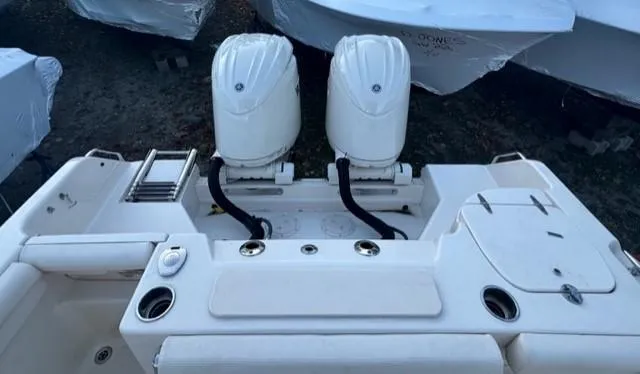 Slide: The Image of 2024 Grady-White 255 FREEDOM boat with dual outboard engines, rear view. - 19