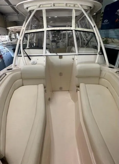 Slide: The Image of 2024 Grady-White 255 FREEDOM boat interior with white seating and spacious cockpit. - 22