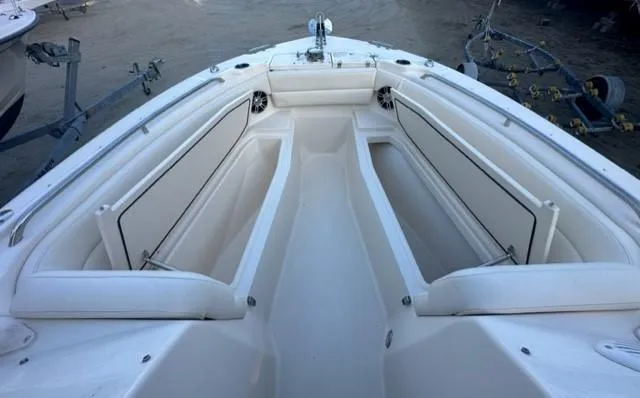 Slide: The Image of 2024 Grady-White 255 FREEDOM boat interior with spacious seating and storage compartments. - 24