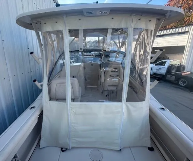 Slide: The Image of 2024 Grady-White 255 FREEDOM boat with enclosed cockpit and seating. - 6