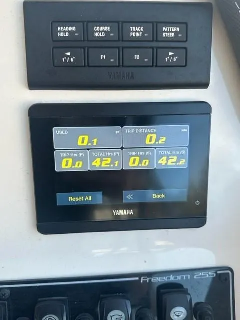 Slide: The Image of 2024 Grady-White 255 FREEDOM dashboard with Yamaha controls and display. - 8