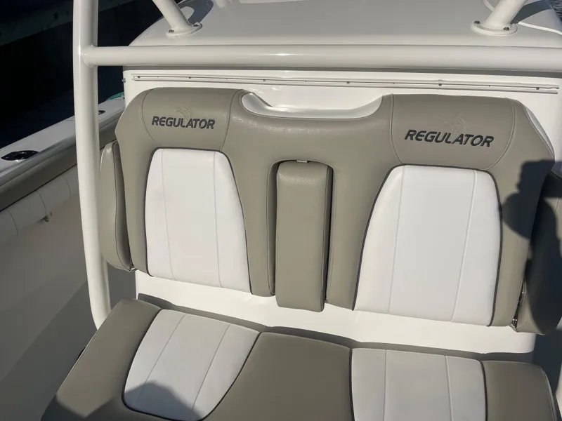 Slide: The Image of 2019 Regulator 34 boat seats with white and gray upholstery. - 10