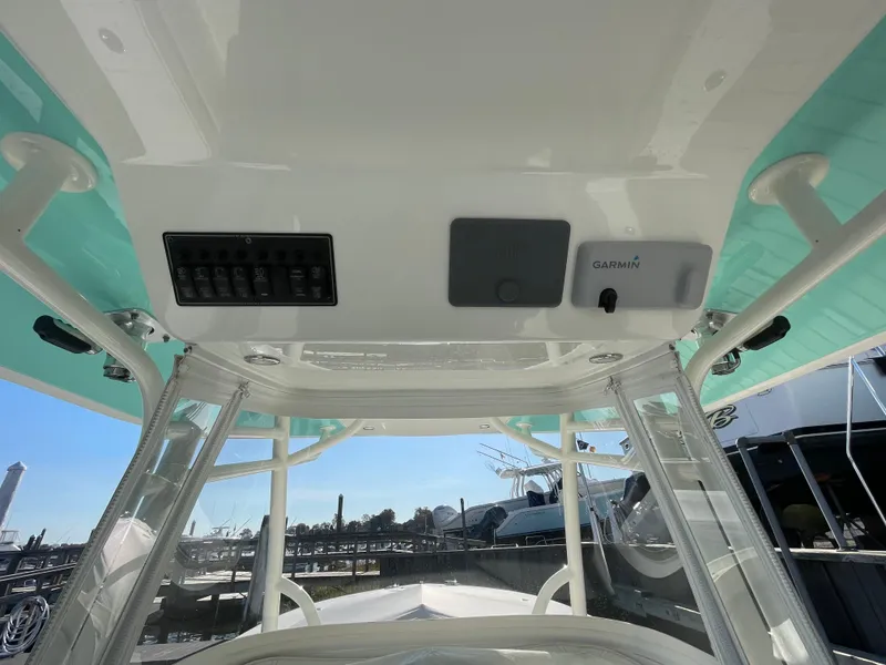 Slide: The Image of 2019 Regulator 34 boat console with Garmin electronics and control panel. - 22