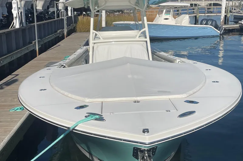 Slide: The Image of 2019 Regulator 34 boat docked at marina, front view. - 28