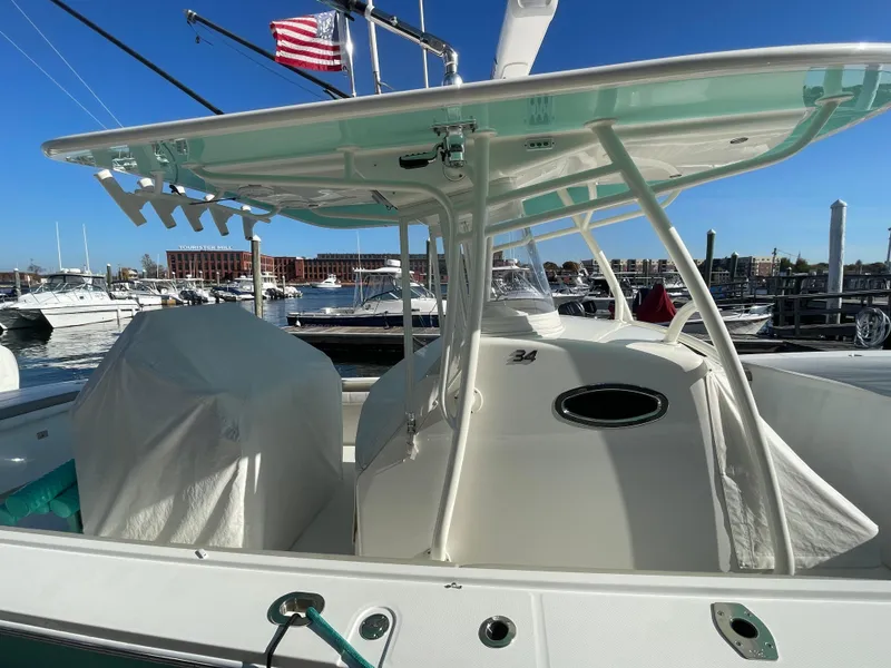 Slide: The Image of 2019 Regulator 34 boat docked at marina with American flag. - 3