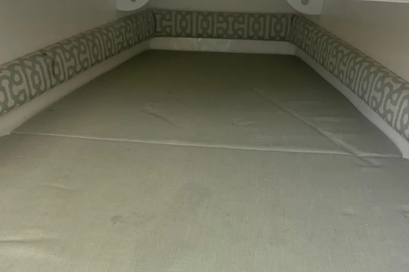 Slide: The Image of 2019 Regulator 34 boat interior cabin with patterned cushions. - 37