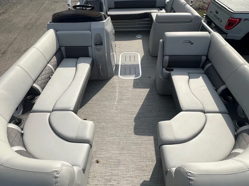 Slide: The Image of 2023 Bennington 22 L SB pontoon boat interior with spacious seating and modern design. - 2
