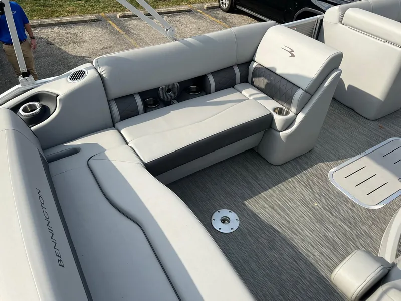 Slide: The Image of 2023 Bennington 22 L SB boat interior with gray seating and cup holders. - 5