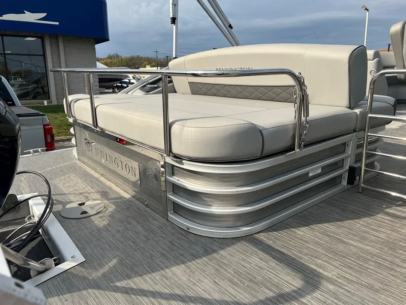 Slide: The Image of 2023 Bennington 22 L SB pontoon boat with cushioned seating and sleek design. - 6