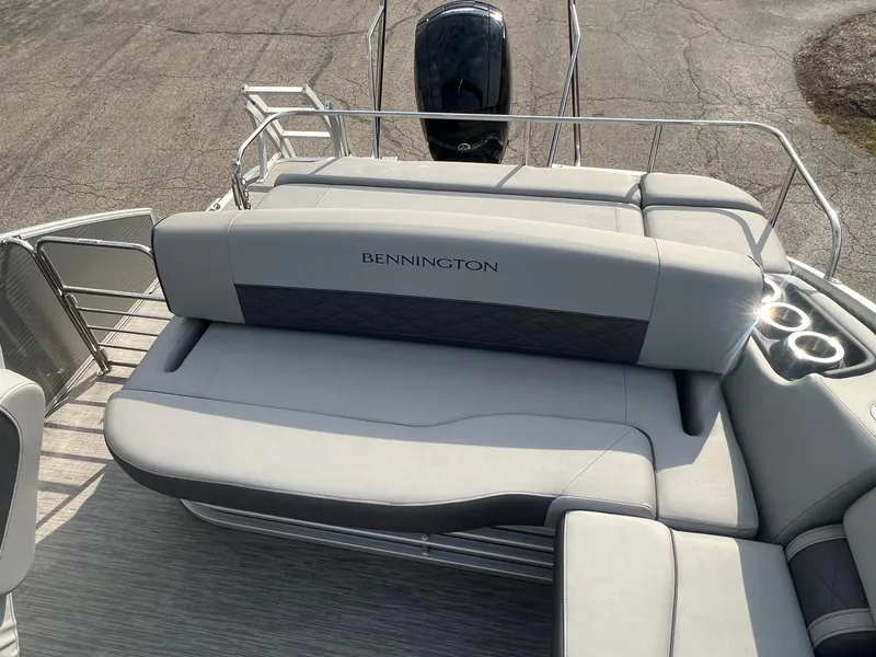 Slide: The Image of 2023 Bennington 22 L SB boat with spacious seating and cup holders. - 7