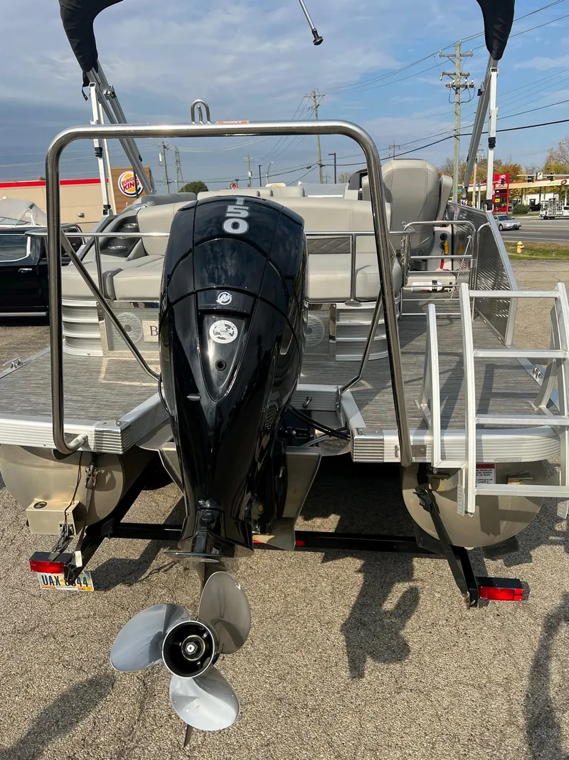 Slide: The Image of 2023 Bennington 22 L SB pontoon boat with outboard motor, rear view. - 8