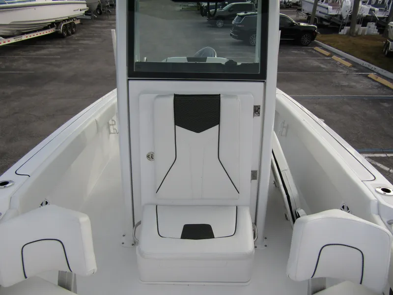 Slide: The Image of 2025 Wellcraft 223 Fisherman boat interior, featuring sleek white seating and modern design. - 10