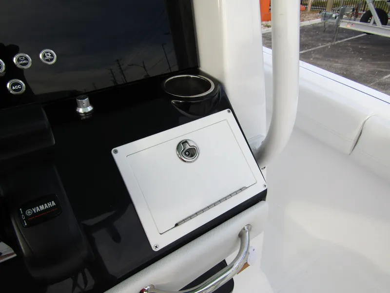 Slide: The Image of 2025 Wellcraft 223 Fisherman console with Yamaha controls and storage compartment. - 19