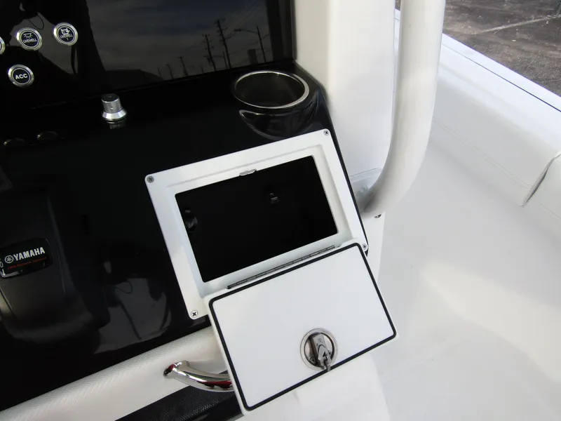 Slide: The Image of 2025 Wellcraft 223 Fisherman console with Yamaha controls and storage compartment. - 20