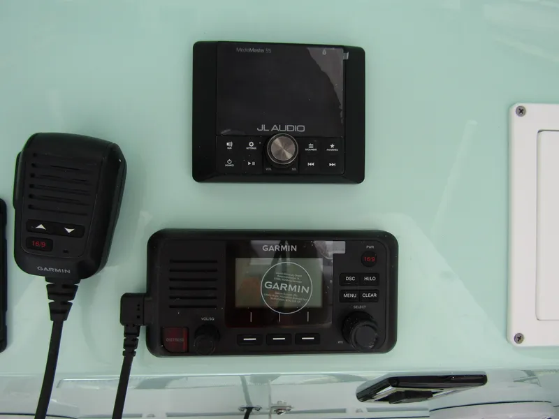 Slide: The Image of Garmin and JL Audio equipment on 2025 Wellcraft 223 Fisherman boat dashboard. - 23