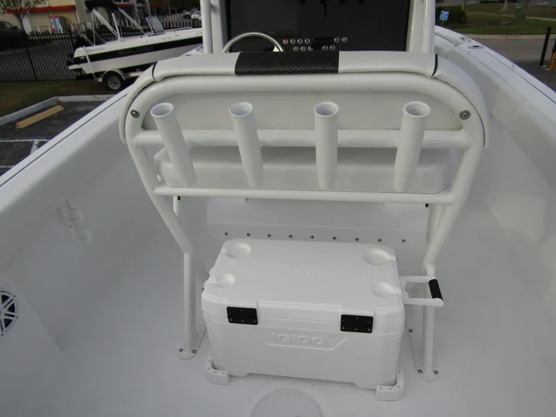 Slide: The Image of 2025 Wellcraft 223 Fisherman boat with rod holders and cooler storage. - 28
