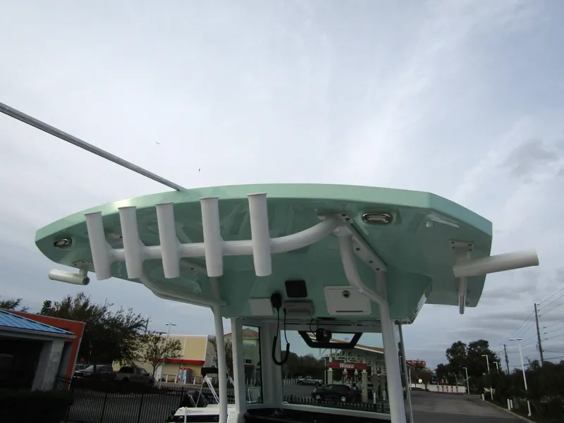 Slide: The Image of 2025 Wellcraft 223 Fisherman boat top view with rod holders and electronics. - 29