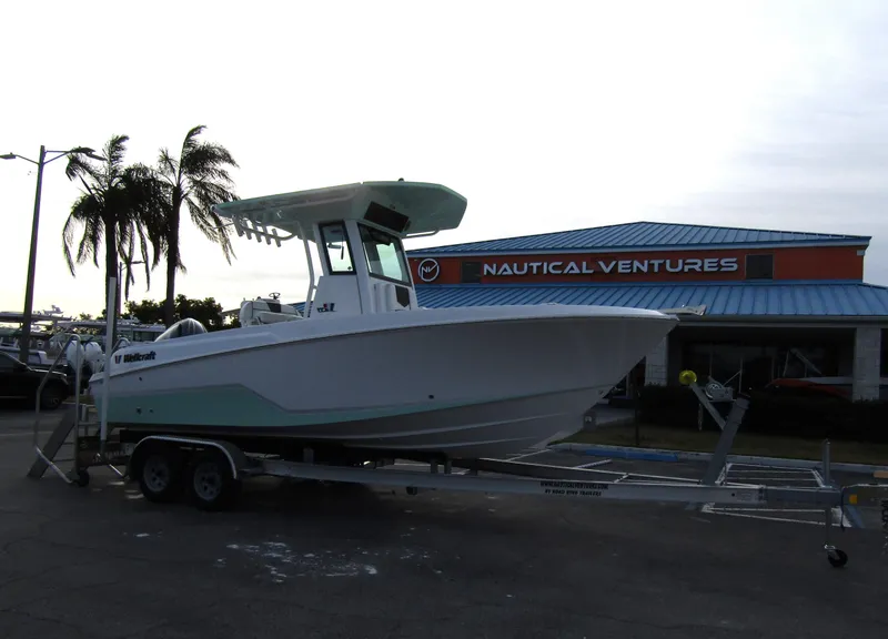 Slide: The Image of 2025 Wellcraft 223 Fisherman boat on trailer at Nautical Ventures dealership. - 4