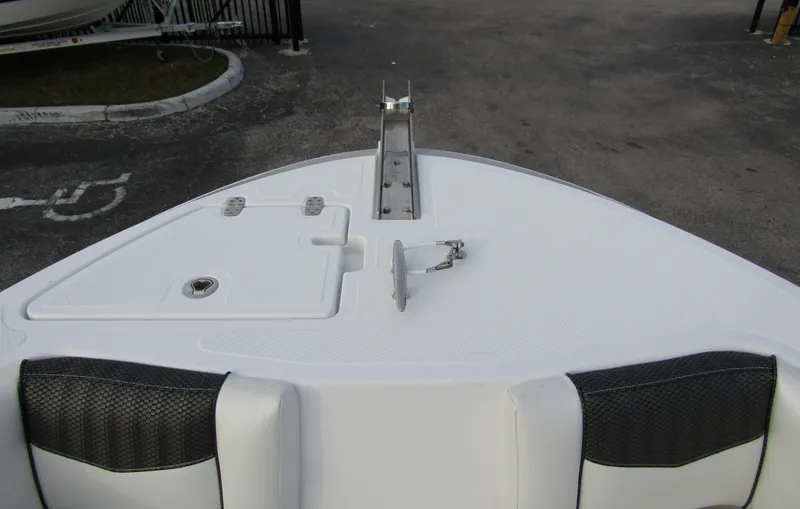 Slide: The Image of 2025 Wellcraft 223 Fisherman boat bow with anchor mount and storage compartments. - 6