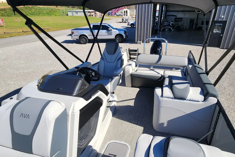 Slide: The Image of 2025 Avalon Platinum Catalina 2585 VRB pontoon boat interior with luxurious seating and helm. - 4