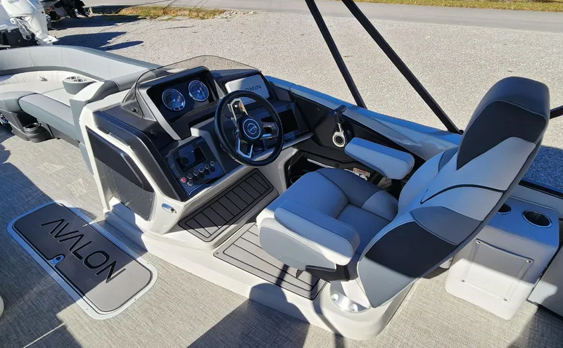 Slide: The Image of 2025 Avalon Platinum Catalina 2585 VRB boat interior with modern helm and comfortable seating. - 5