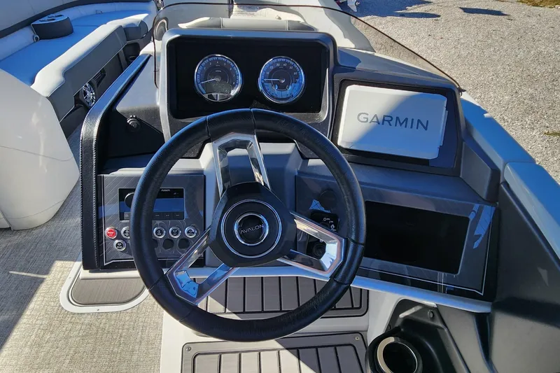 Slide: The Image of 2025 Avalon Platinum Catalina 2585 VRB dashboard with Garmin navigation and steering wheel. - 6